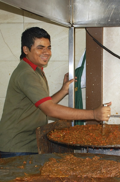 A street vendor preparing dal makhani in Mumbai.